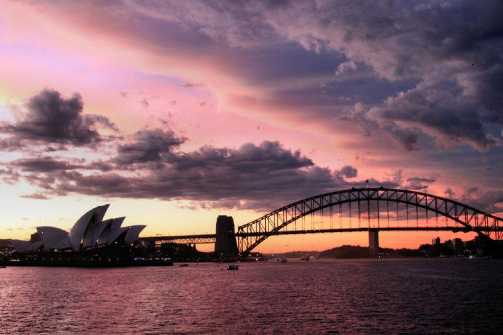 Sydney opera house and harbour bridge at sunset