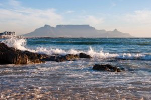view of table mountain and cape town from bloubergstrand