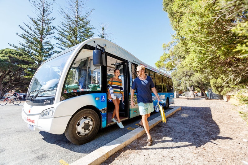 Two people getting off a Rottnest Island bus tour