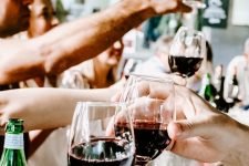 People toasting with wine glasses