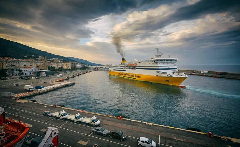 A yellow and white ferry at sea.