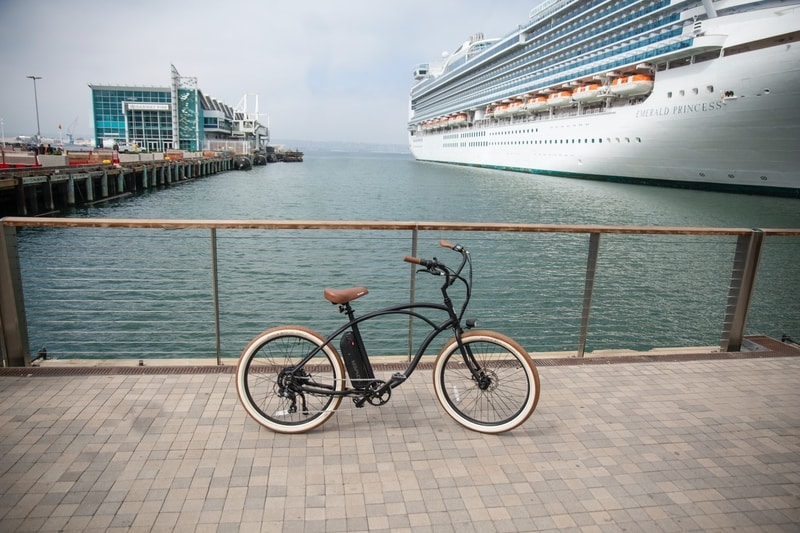 Bike on the port with cruise ship in the back