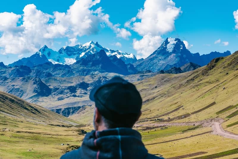 Man looking at the Andes Mountains