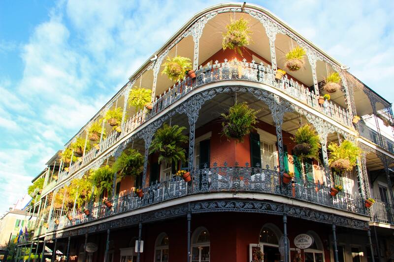 Building in New Orleans with plants hanging from balcony