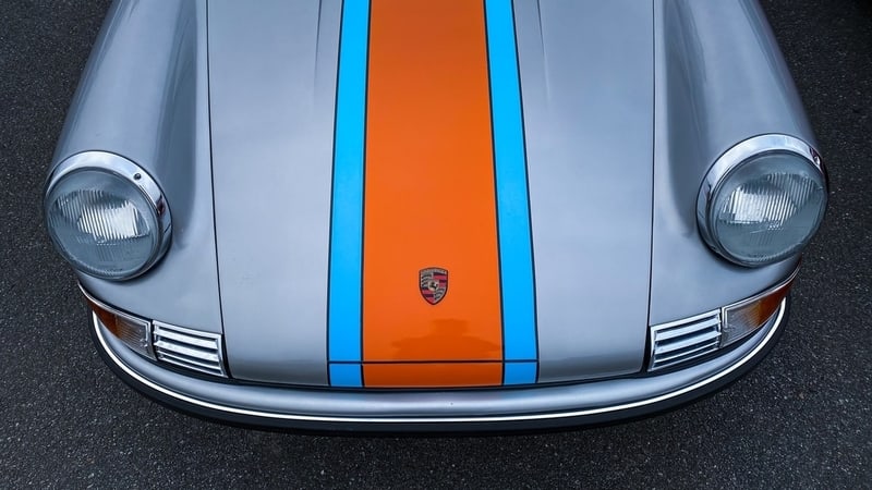 Top view of car with silver, orange, and light blue detail.