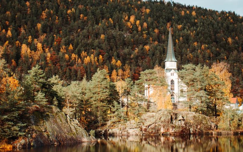 Church surrounded by trees in autumn