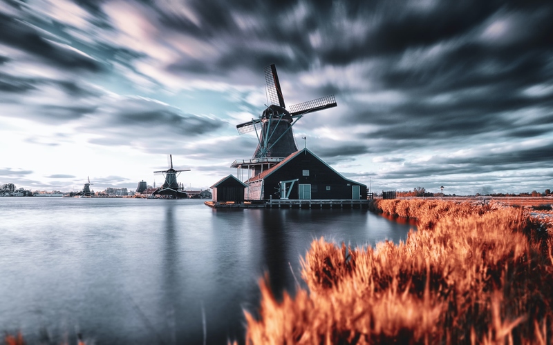 Windmill in Netherlands on a cloudy day in Autumn