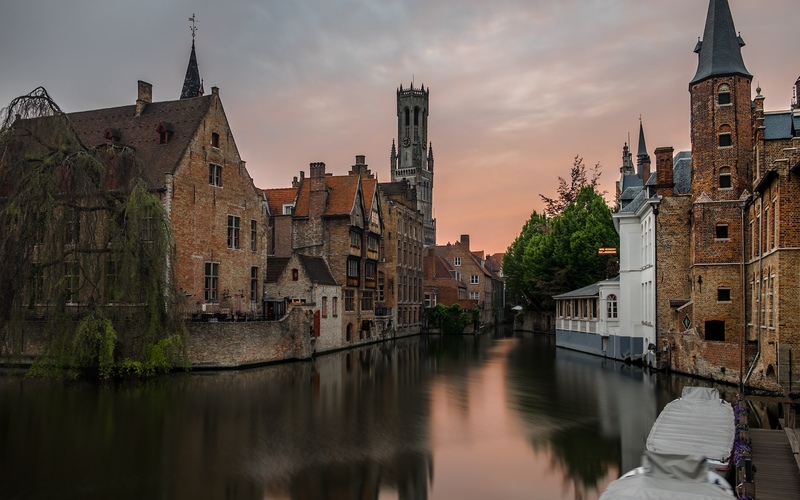 Houses on a canal in Brugge, Belgium at sunset