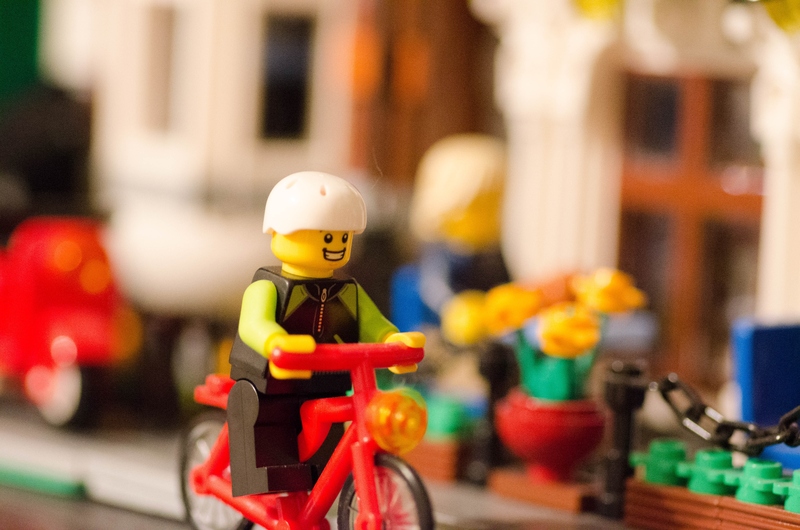 lego man riding a bicycle