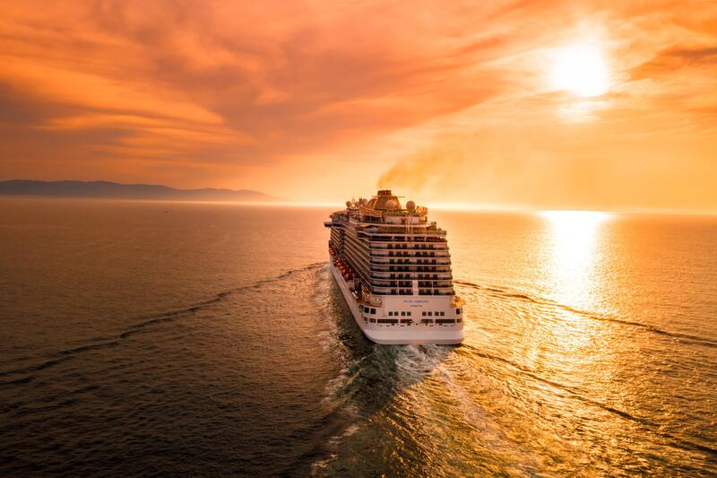 Cruise ship on the water at sunset