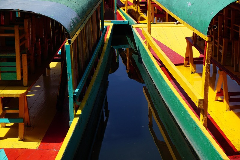 A close-up view of two colorful boats on the river